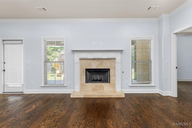 9148 Autumnbrooke Way, Montgomery, AL 36117 - unfurnished living room featuring ornamental molding, wood finished floors, a tile fireplace, and baseboards
