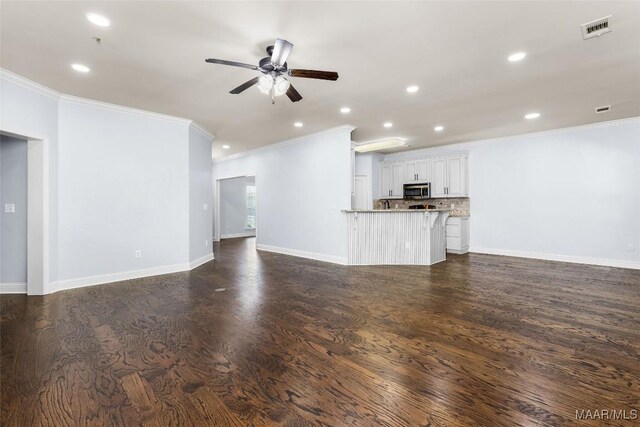 9148 Autumnbrooke Way, Montgomery, AL 36117 - unfurnished living room featuring crown molding, a ceiling fan, recessed lighting, baseboards, and dark wood-style flooring