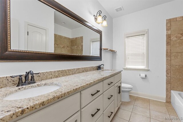 9148 Autumnbrooke Way, Montgomery, AL 36117 - bathroom featuring double vanity, toilet, tile patterned floors, and baseboards