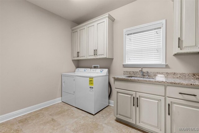 9148 Autumnbrooke Way, Montgomery, AL 36117 - laundry room with cabinet space, baseboards, and washing machine and dryer