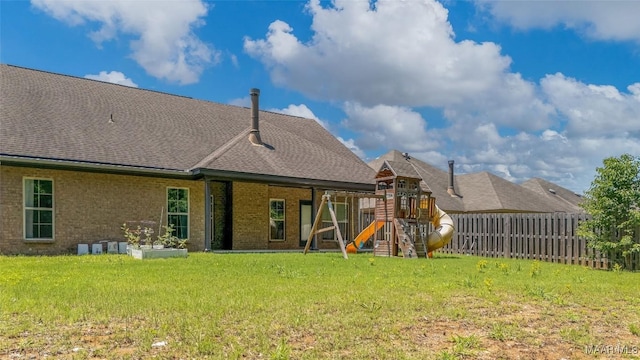 9148 Autumnbrooke Way, Montgomery, AL 36117 - rear view of property with a playground, brick siding, and roof with shingles