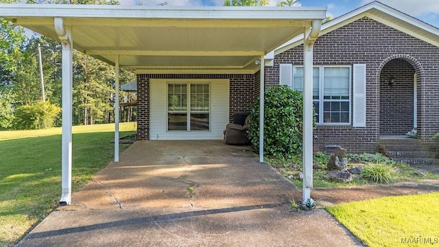 5241 County Road 48th Rd, Jemison, AL 35085 - property entrance featuring brick siding, a lawn, and a carport
