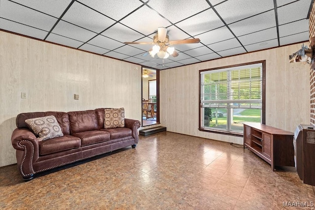 5241 County Road 48th Rd, Jemison, AL 35085 - living area featuring a ceiling fan, wood walls, and a paneled ceiling