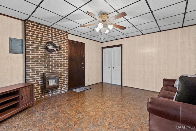 5241 County Road 48th Rd, Jemison, AL 35085 - living area with a ceiling fan, wooden walls, electric panel, a brick fireplace, and heating unit