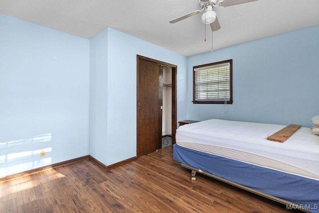 5241 County Road 48th Rd, Jemison, AL 35085 - bedroom featuring wood finished floors, baseboards, ceiling fan, and a closet