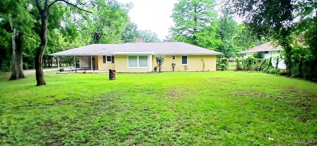 3615 Audubon Rd, Montgomery, AL 36111 - back of house with a lawn and a chimney