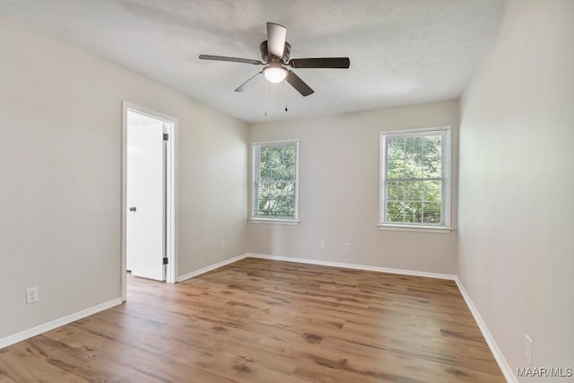 302 Janice St, Prattville, AL 36066 - empty room featuring a ceiling fan, wood finished floors, and baseboards