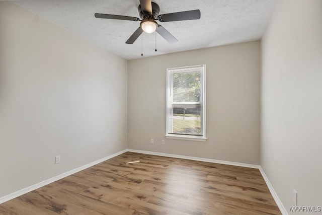 302 Janice St, Prattville, AL 36066 - unfurnished room with wood finished floors, a textured ceiling, baseboards, and a ceiling fan