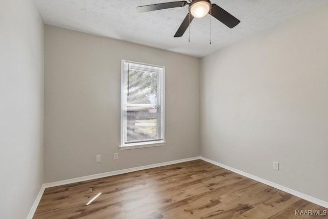 302 Janice St, Prattville, AL 36066 - unfurnished room featuring wood finished floors, baseboards, ceiling fan, and a textured ceiling