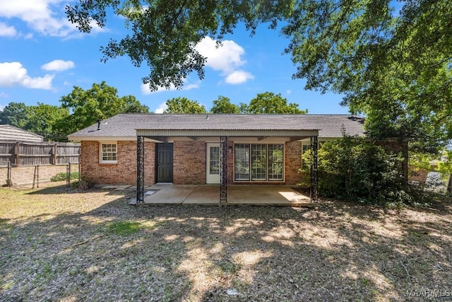 302 Janice St, Prattville, AL 36066 - rear view of house with a patio and brick siding