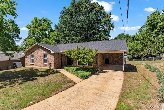 302 Janice St, Prattville, AL 36066 - ranch-style house with brick siding, concrete driveway, a shingled roof, and a carport
