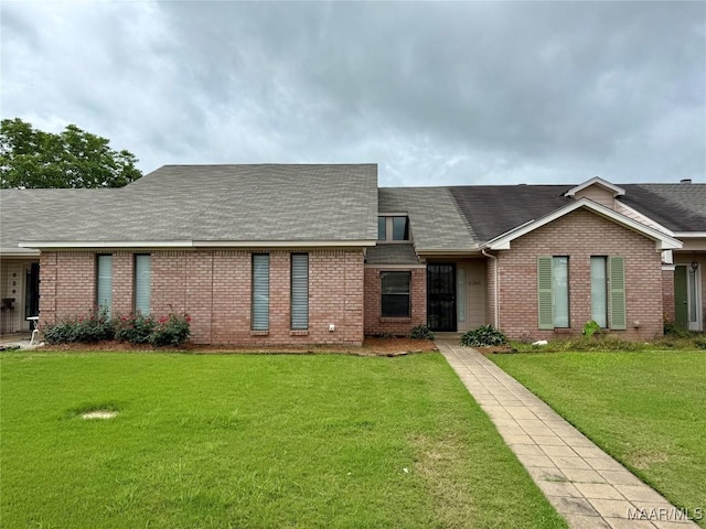6260 Bell Gables Cir, Montgomery, AL 36117 - view of front of home featuring brick siding, a front yard, and a shingled roof