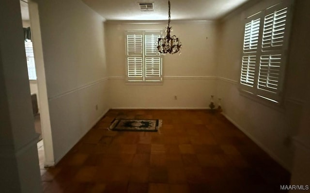 2700 W Edgemont Ave, Montgomery, AL 36108 - unfurnished dining area featuring a chandelier and tile patterned floors
