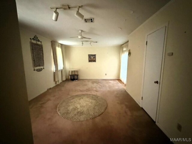 2700 W Edgemont Ave, Montgomery, AL 36108 - empty room featuring a ceiling fan, carpet, and track lighting