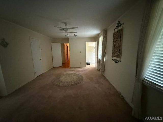 2700 W Edgemont Ave, Montgomery, AL 36108 - unfurnished room with light colored carpet, ceiling fan, and plenty of natural light