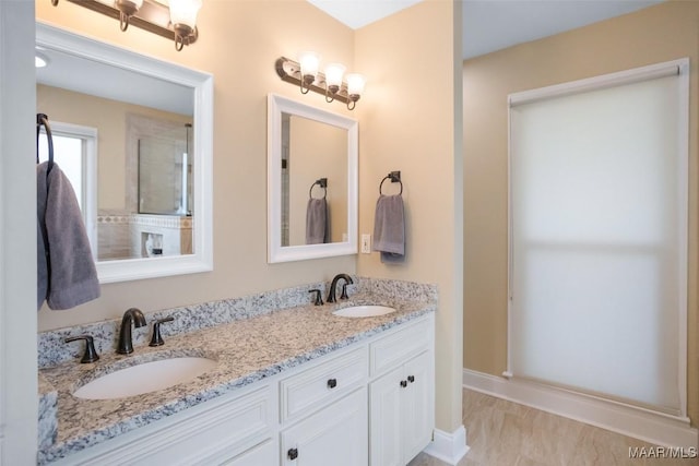 8945 Chantilly Way, Montgomery, AL 36116 - bathroom with double vanity, marble finish floors, and baseboards