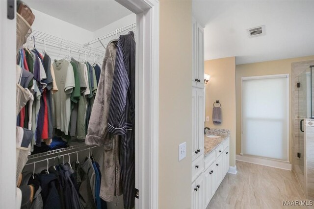 8945 Chantilly Way, Montgomery, AL 36116 - spacious closet with a sink