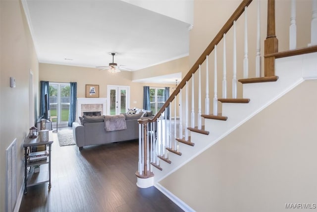8945 Chantilly Way, Montgomery, AL 36116 - staircase featuring ceiling fan, wood finished floors, and a fireplace