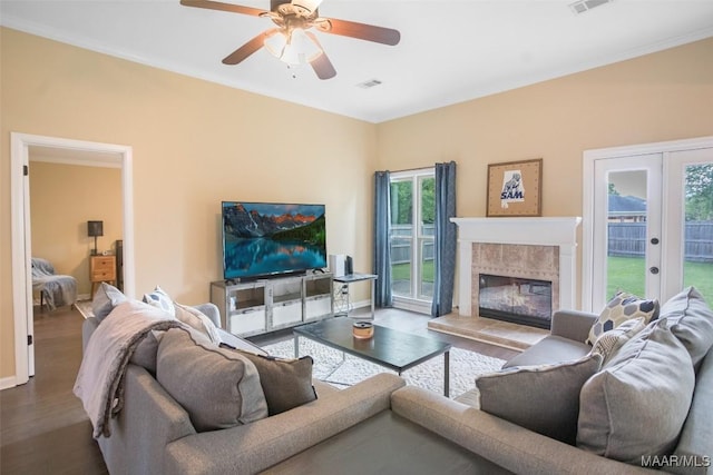 8945 Chantilly Way, Montgomery, AL 36116 - living room featuring healthy amount of natural light, wood finished floors, a ceiling fan, a fireplace, and ornamental molding