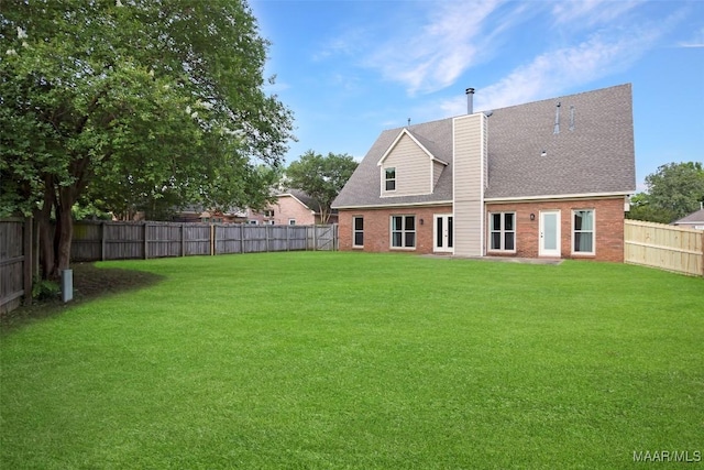 8945 Chantilly Way, Montgomery, AL 36116 - rear view of house featuring a chimney, brick siding, and a shingled roof