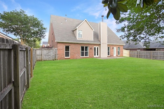 8945 Chantilly Way, Montgomery, AL 36116 - back of property with brick siding, a chimney, roof with shingles, and a patio