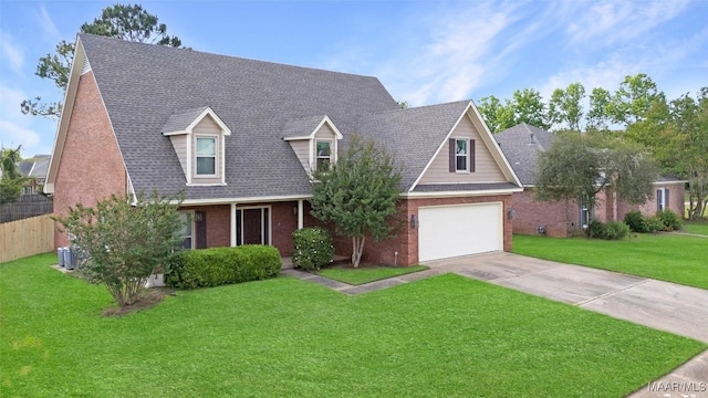 8945 Chantilly Way, Montgomery, AL 36116 - cape cod-style house featuring brick siding, driveway, a garage, and a shingled roof