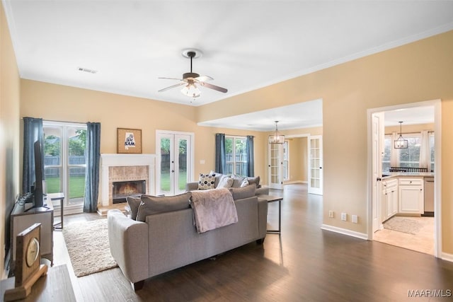 8945 Chantilly Way, Montgomery, AL 36116 - living room featuring dark wood finished floors, french doors, a high end fireplace, a ceiling fan, and baseboards