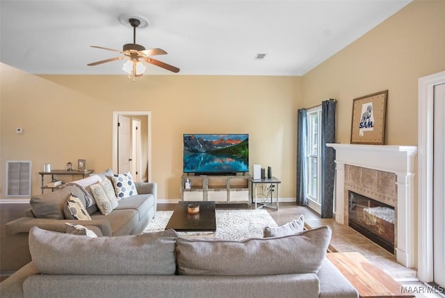 8945 Chantilly Way, Montgomery, AL 36116 - living area featuring a ceiling fan, a tile fireplace, and baseboards