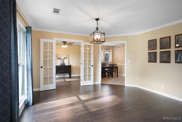 8945 Chantilly Way, Montgomery, AL 36116 - dining room featuring french doors, a chandelier, wood finished floors, ornamental molding, and baseboards