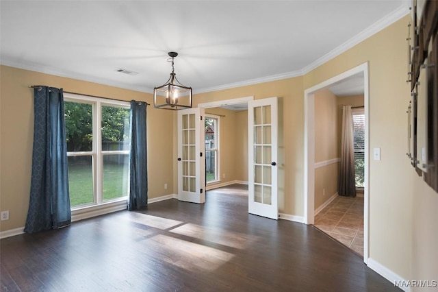 8945 Chantilly Way, Montgomery, AL 36116 - unfurnished dining area featuring french doors, dark wood-style floors, a chandelier, crown molding, and baseboards