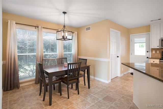 8945 Chantilly Way, Montgomery, AL 36116 - dining space with a chandelier and baseboards