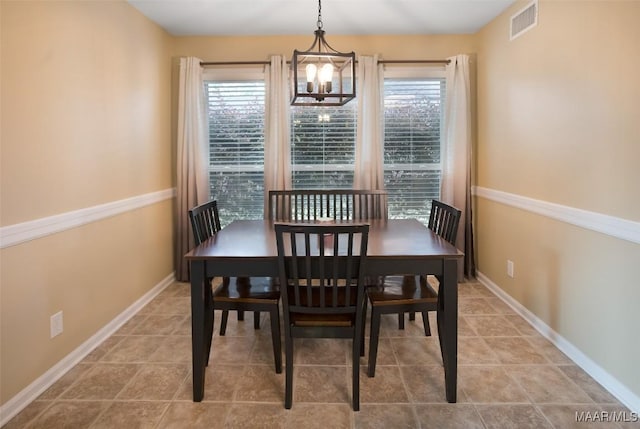 8945 Chantilly Way, Montgomery, AL 36116 - dining room featuring a chandelier, baseboards, and tile patterned flooring
