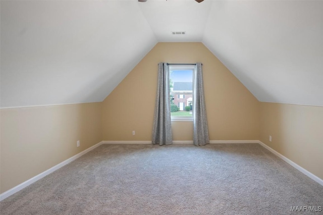 8945 Chantilly Way, Montgomery, AL 36116 - additional living space with carpet flooring, lofted ceiling, ceiling fan, and baseboards
