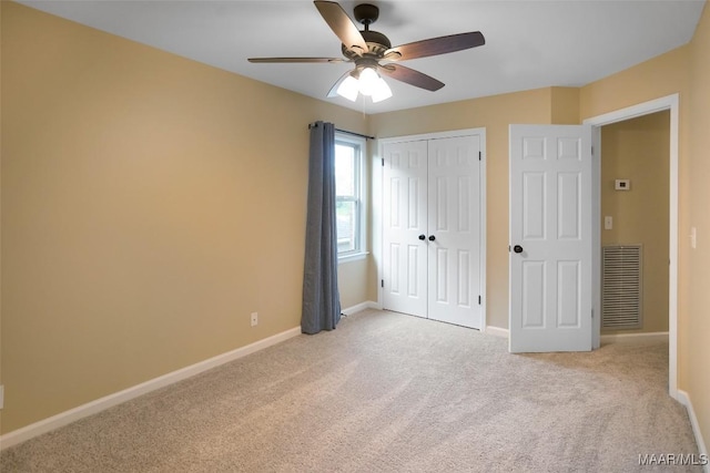 8945 Chantilly Way, Montgomery, AL 36116 - unfurnished bedroom featuring light carpet, baseboards, a closet, and a ceiling fan