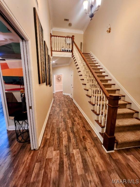 103 River Chase Ct, Wetumpka, AL 36092 - stairway featuring wood finished floors, baseboards, and crown molding
