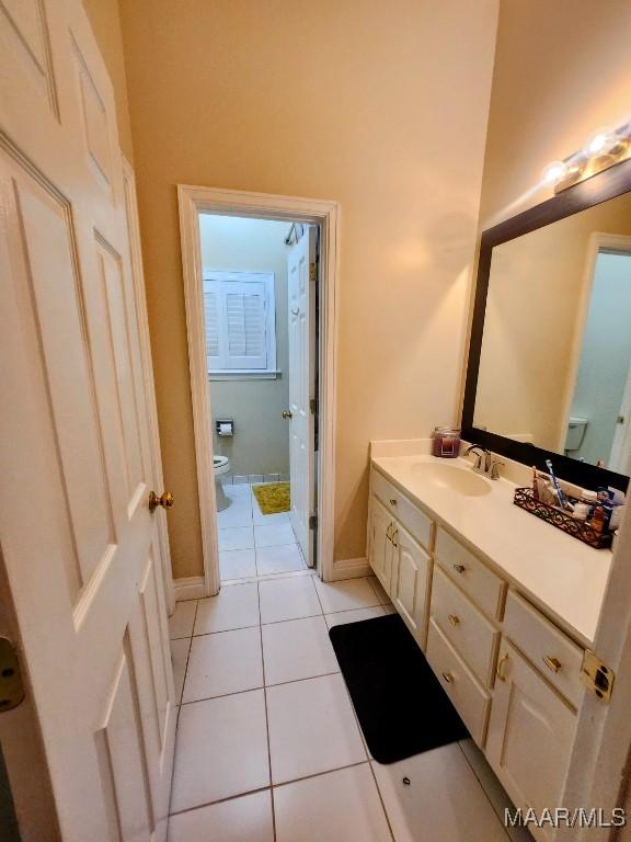 103 River Chase Ct, Wetumpka, AL 36092 - bathroom with toilet, vanity, tile patterned floors, and baseboards