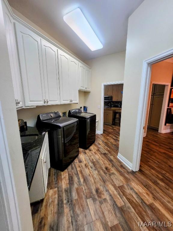 103 River Chase Ct, Wetumpka, AL 36092 - laundry room featuring cabinet space, washing machine and clothes dryer, dark wood-style flooring, and baseboards