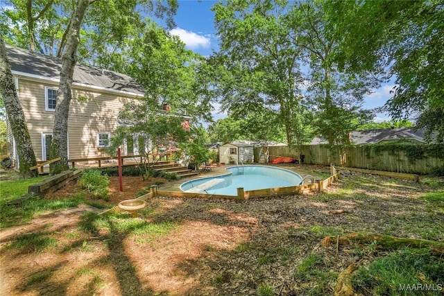 184 Fox Hollow Rd, Montgomery, AL 36109 - view of swimming pool featuring a deck and a fenced backyard