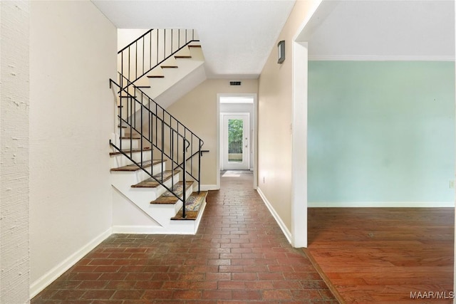 184 Fox Hollow Rd, Montgomery, AL 36109 - foyer entrance with brick floors, baseboards, and stairway