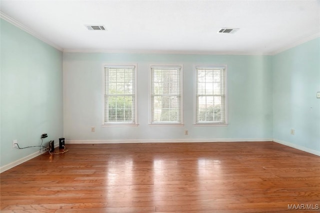 184 Fox Hollow Rd, Montgomery, AL 36109 - unfurnished room with light wood finished floors, ornamental molding, and baseboards
