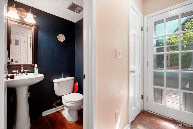 184 Fox Hollow Rd, Montgomery, AL 36109 - bathroom with toilet, wood finished floors, baseboards, and a sink