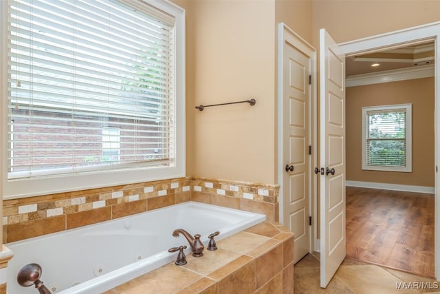 8460 Rockbridge Cir, Montgomery, AL 36116 - full bathroom featuring a jetted tub, ornamental molding, and tile patterned flooring