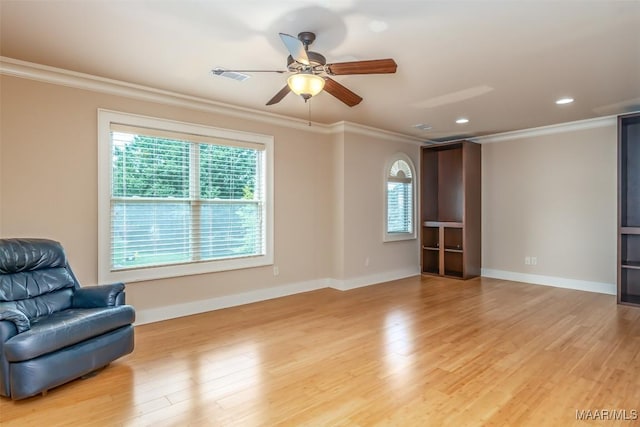 8460 Rockbridge Cir, Montgomery, AL 36116 - sitting room with crown molding, plenty of natural light, a ceiling fan, light wood-style floors, and baseboards