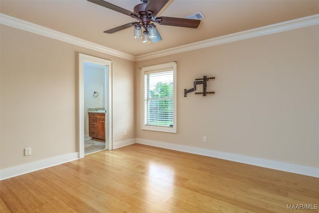 8460 Rockbridge Cir, Montgomery, AL 36116 - unfurnished room featuring light wood-style flooring, crown molding, ceiling fan, and baseboards