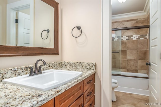 8460 Rockbridge Cir, Montgomery, AL 36116 - bathroom featuring toilet, vanity, crown molding, shower / bath combination with glass door, and tile patterned floors