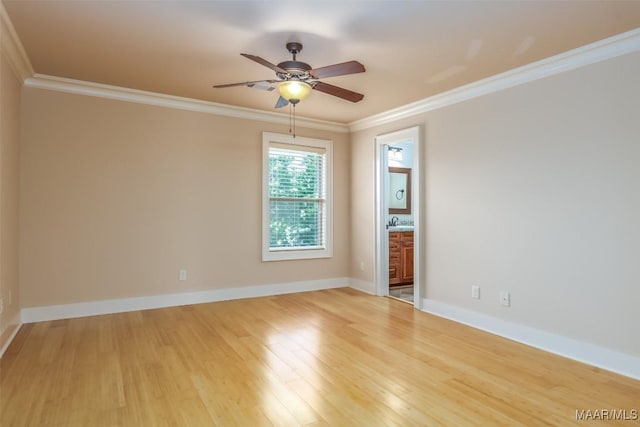 8460 Rockbridge Cir, Montgomery, AL 36116 - spare room with crown molding, ceiling fan, light wood finished floors, a sink, and baseboards