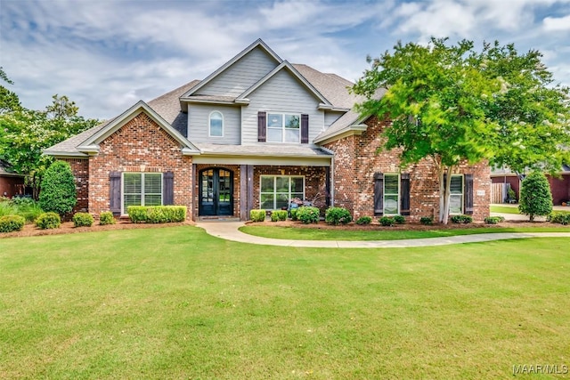 8460 Rockbridge Cir, Montgomery, AL 36116 - view of front of property featuring a front lawn, brick siding, roof with shingles, and french doors