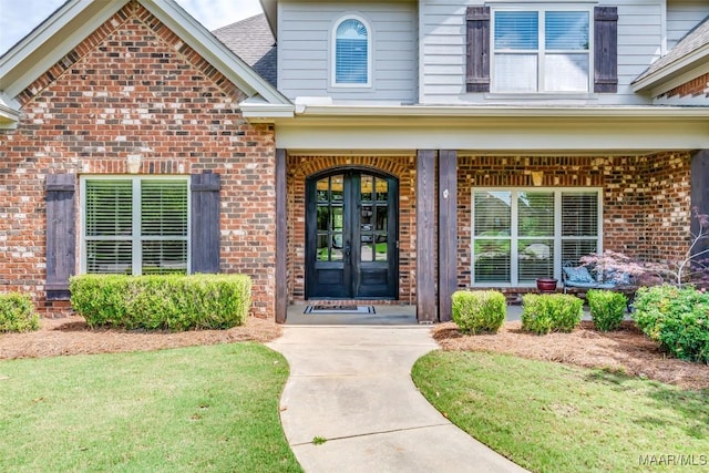 8460 Rockbridge Cir, Montgomery, AL 36116 - entrance to property featuring brick siding, a porch, and a lawn