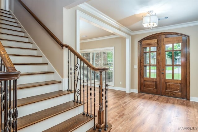 8460 Rockbridge Cir, Montgomery, AL 36116 - entryway with light wood-type flooring, french doors, stairs, ornamental molding, and plenty of natural light