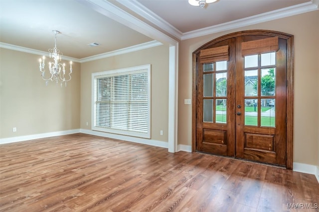 8460 Rockbridge Cir, Montgomery, AL 36116 - foyer with french doors, wood finished floors, a chandelier, crown molding, and baseboards